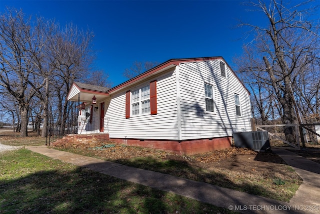 view of side of home with crawl space and cooling unit