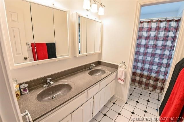 full bathroom with double vanity, a sink, and a shower with shower curtain