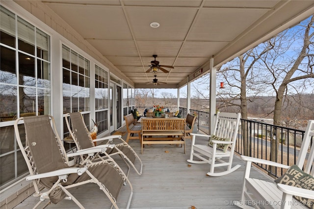 wooden deck with ceiling fan