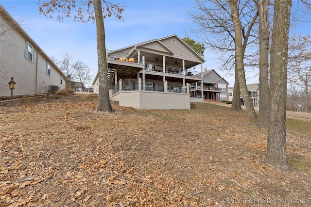 view of front facade featuring central AC and ceiling fan