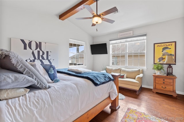 bedroom with a ceiling fan, lofted ceiling with beams, baseboards, and hardwood / wood-style flooring