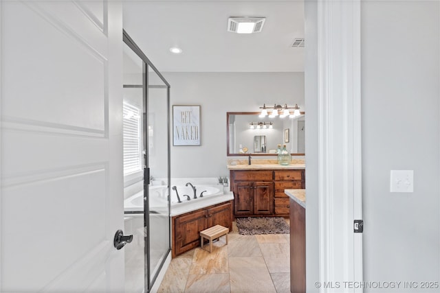 bathroom with a shower stall, visible vents, a bath, and vanity