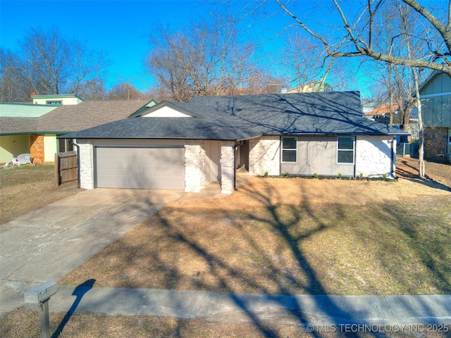 single story home featuring a front lawn, an attached garage, driveway, and roof with shingles