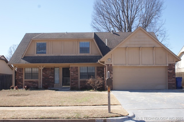 view of front of house featuring brick siding, concrete driveway, an attached garage, board and batten siding, and a front yard