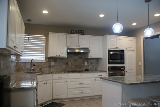 kitchen with black appliances, a sink, white cabinets, and under cabinet range hood