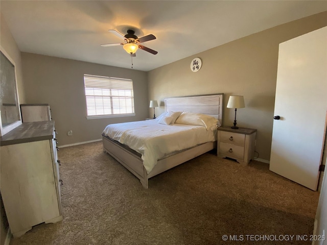 carpeted bedroom with baseboards and a ceiling fan