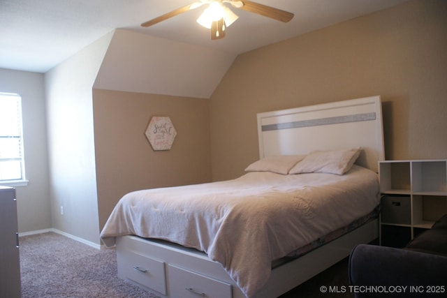 carpeted bedroom with lofted ceiling, ceiling fan, and baseboards