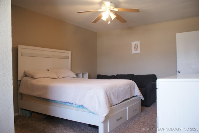 bedroom featuring a ceiling fan and carpet