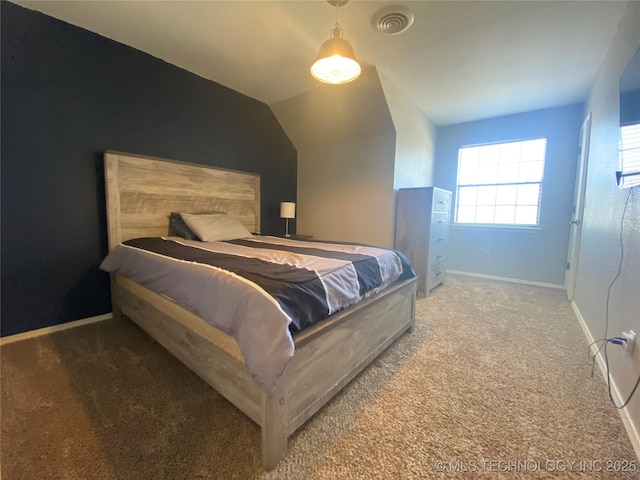 bedroom featuring lofted ceiling, carpet, visible vents, and baseboards