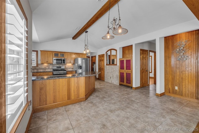 kitchen with lofted ceiling with beams, appliances with stainless steel finishes, brown cabinets, tasteful backsplash, and glass insert cabinets