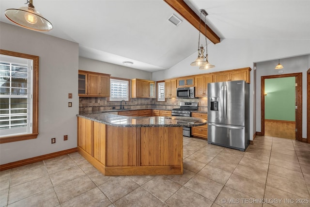 kitchen with tasteful backsplash, visible vents, glass insert cabinets, a peninsula, and stainless steel appliances