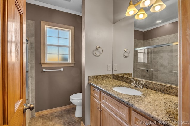 bathroom featuring toilet, ornamental molding, vanity, tiled shower, and baseboards