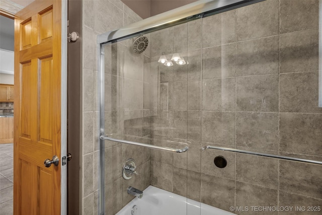 full bathroom with bath / shower combo with glass door