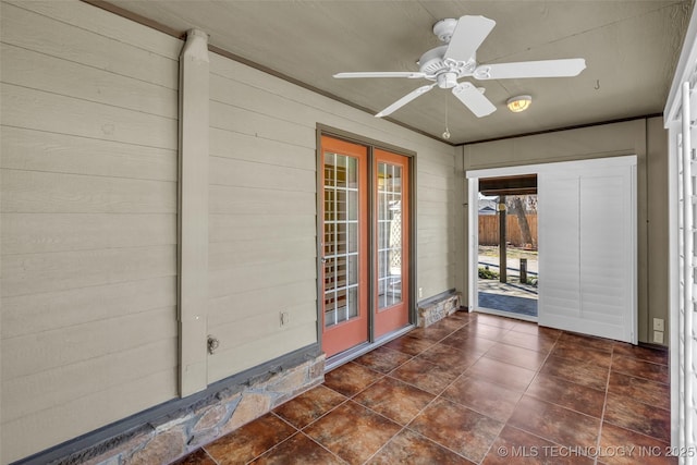 exterior space featuring ceiling fan