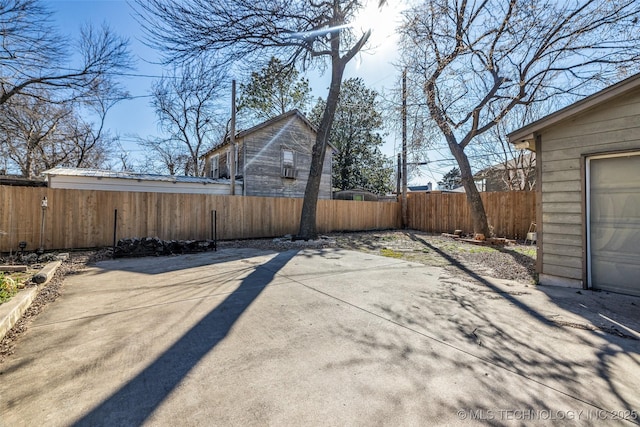 exterior space with a garage and fence