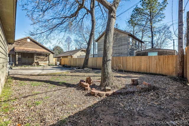 view of yard featuring a patio area and fence