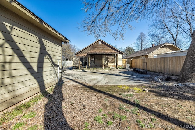 view of yard featuring a patio and fence