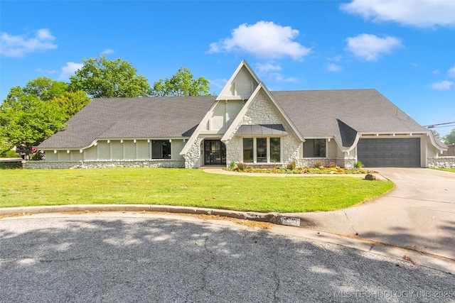 view of front of house with a shingled roof, concrete driveway, stone siding, an attached garage, and a front lawn