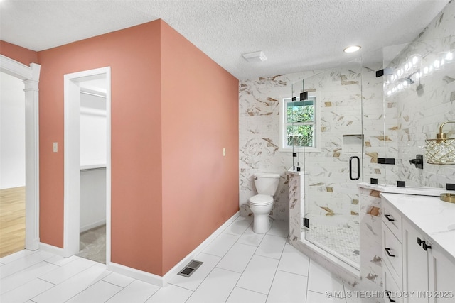 full bathroom with a textured ceiling, toilet, visible vents, a marble finish shower, and ornate columns