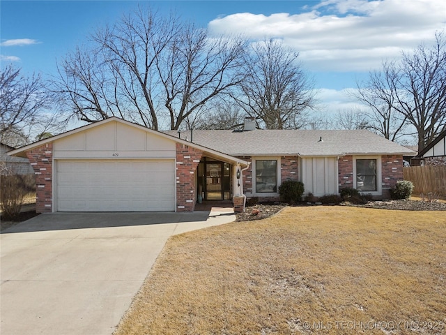 view of front of home with concrete driveway, an attached garage, fence, and brick siding