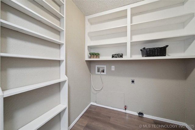 clothes washing area with gas dryer hookup, washer hookup, laundry area, wood finished floors, and hookup for an electric dryer