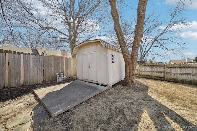 view of shed featuring a fenced backyard