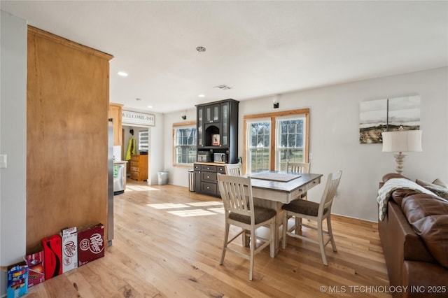 dining area featuring light wood-style floors, recessed lighting, and visible vents