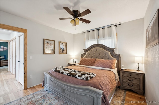 bedroom featuring ceiling fan and wood finished floors