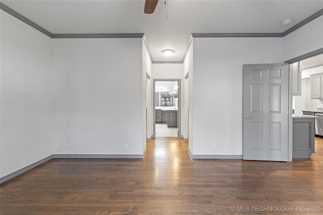 empty room featuring a ceiling fan, ornamental molding, and dark wood-style flooring