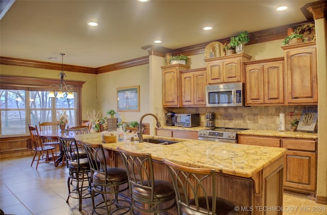 3402 Harbour Town Pl, Claremore, OK 74019 - kitchen with stainless steel appliances, tasteful backsplash, light stone counters, recessed lighting, and a kitchen breakfast bar