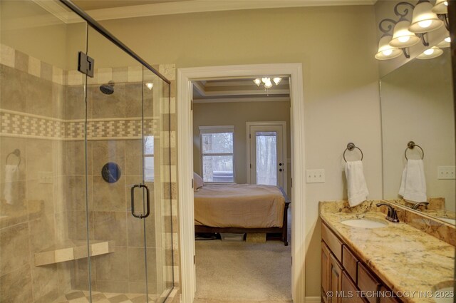 bathroom featuring ornamental molding, a stall shower, connected bathroom, and vanity