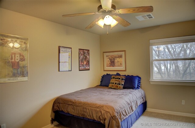 bedroom featuring ceiling fan, carpet, visible vents, and baseboards