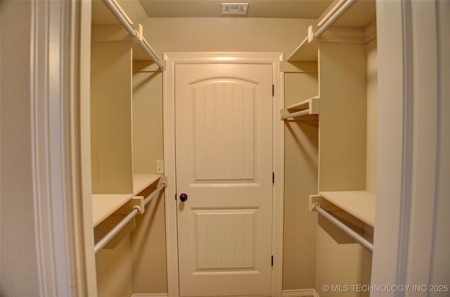 walk in closet featuring visible vents