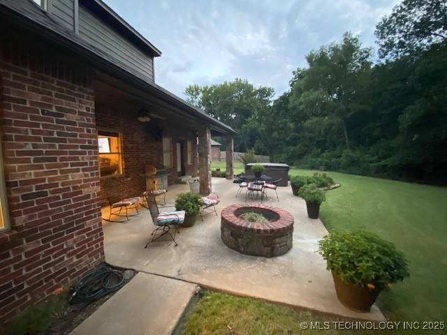 view of patio featuring a fire pit and area for grilling