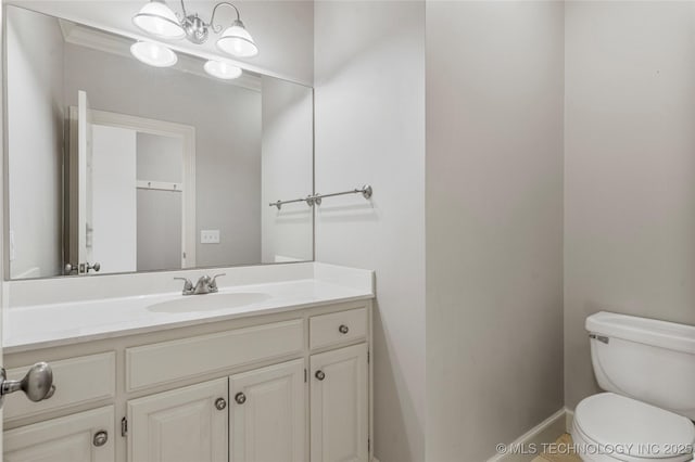 11630 S Fulton Ave, Tulsa, OK 74137 - bathroom with toilet, vanity, and baseboards