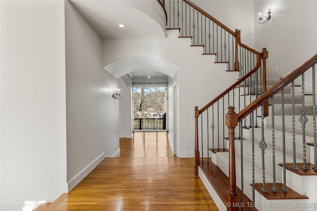 11630 S Fulton Ave, Tulsa, OK 74137 - entryway with arched walkways, wood finished floors, and stairs