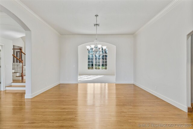 11630 S Fulton Ave, Tulsa, OK 74137 - unfurnished dining area featuring arched walkways, a chandelier, light wood finished floors, stairs, and crown molding