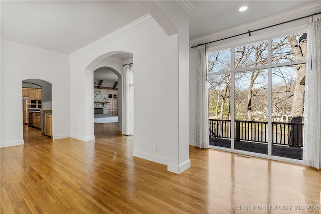 11630 S Fulton Ave, Tulsa, OK 74137 - unfurnished room featuring baseboards, light wood finished floors, ornamental molding, a large fireplace, and recessed lighting