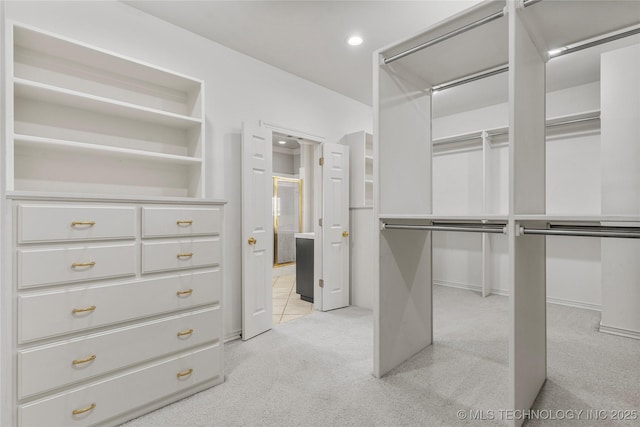 11630 S Fulton Ave, Tulsa, OK 74137 - walk in closet featuring light carpet