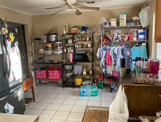 storage room featuring ceiling fan and visible vents