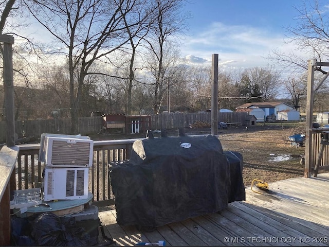 wooden deck featuring fence and grilling area