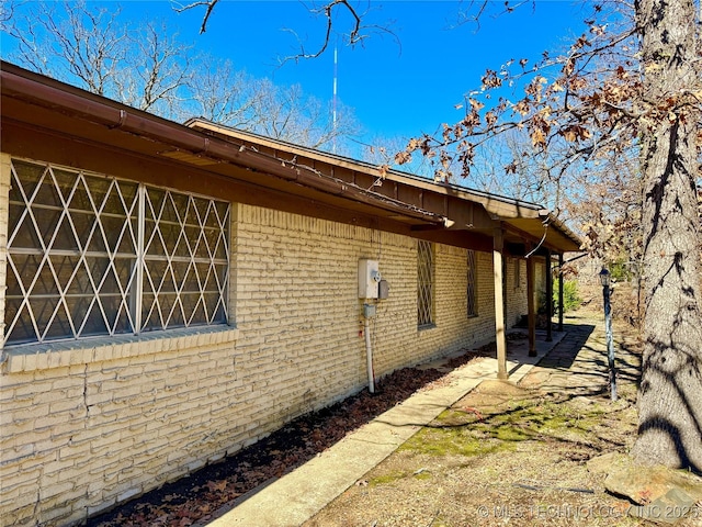 view of home's exterior with brick siding
