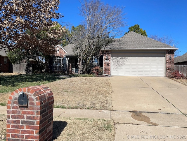 ranch-style home with driveway, brick siding, a shingled roof, an attached garage, and a front yard