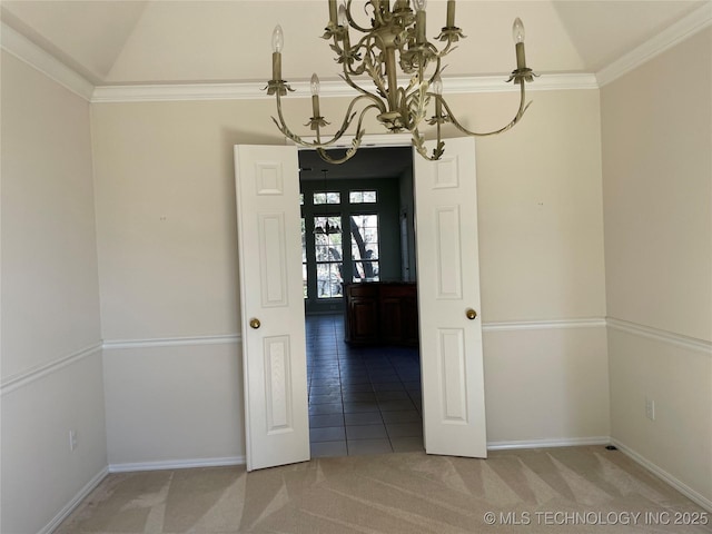 unfurnished dining area featuring a notable chandelier, vaulted ceiling, french doors, ornamental molding, and carpet