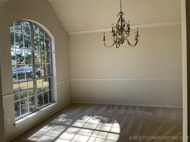 unfurnished dining area with carpet floors, vaulted ceiling, baseboards, and an inviting chandelier