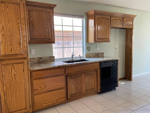 kitchen featuring black dishwasher, brown cabinetry, light tile patterned flooring, and a sink