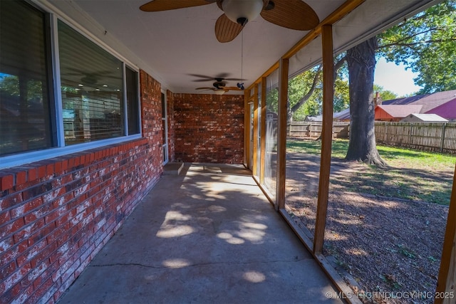 view of patio / terrace featuring fence and a ceiling fan