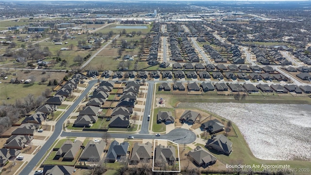 11923 E 105th Ct N, Owasso, OK 74055 - aerial view of property's location with nearby suburban area and a large body of water