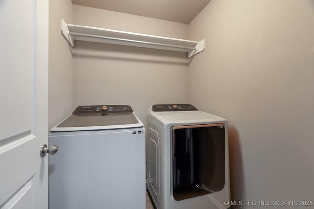 laundry area with laundry area and separate washer and dryer