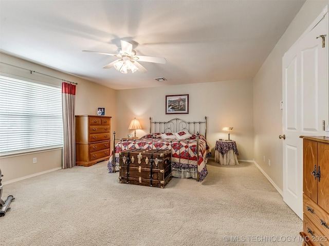 bedroom with baseboards, visible vents, ceiling fan, and carpet flooring